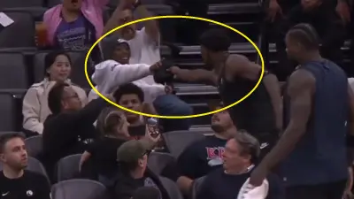 Anthony Edwards giving his jersey to a fan