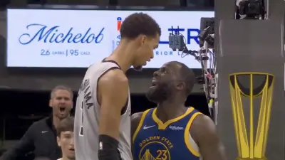 Victor Wembanyama staring down Draymond Green during a Warriors-Spurs game
